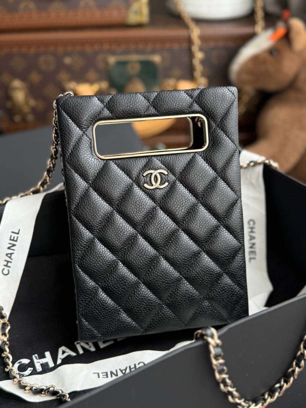 CHANEL Black Quilted Leather Phone Pouch with Gold-Tone CC